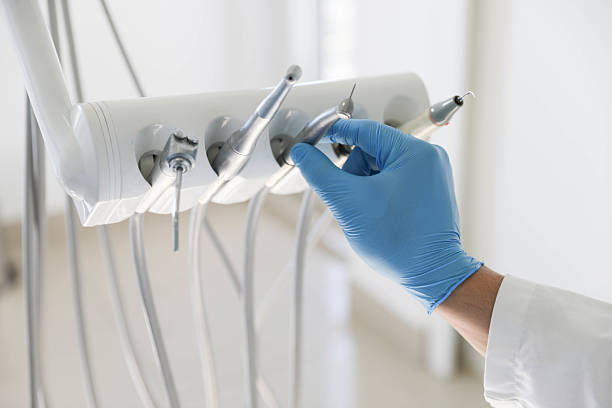 Professional Tooth Extraction technician working in Grain Valley, MO